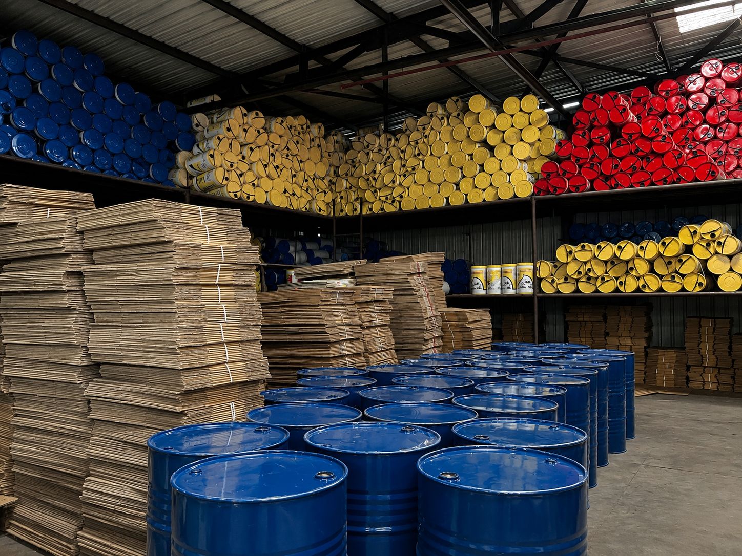 Organized drum storage racks in the Goldtap raw material area